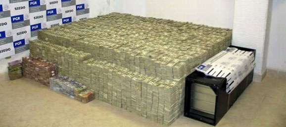 real stacks of money on bed